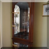 F13. Mahogany corner curio cabinet. 78”h x 29”w x 19”d 